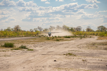 Obraz na płótnie Canvas Botswana safari airfield where small passenger aircraft service the Okavanga Delta and Moremi Game Reserve and Chobe National Park safari industries