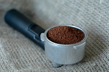 coffee pause, fresh coffee for coffee grinder into a portafilter for a professional espresso machine