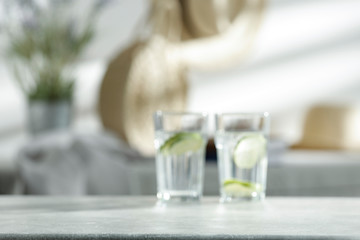 Mineral water in a glass on the table on a beautiful sunny day in the sunshine