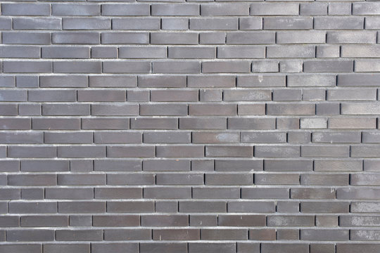 Abstract background of a fragment of the blank clean wall from rectangular white silicate brick