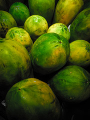 stack of tropical fruit with green skin