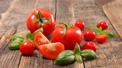 tomato and basil on wood background
