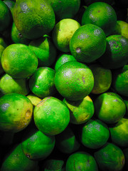 stack of tropical fruit with green skin