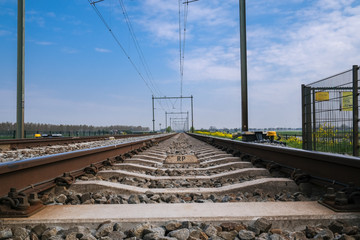 Railroad way going into the distance, The Netherlands