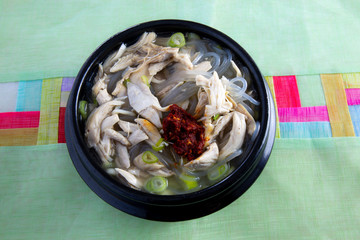 Chicken soup with red sauce which is called dalg-gomtang in Korea