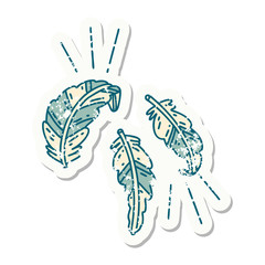 Naklejka premium grunge sticker of tattoo style feathers floating