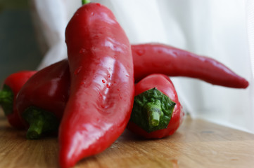 Fresh red bell peppers on the table