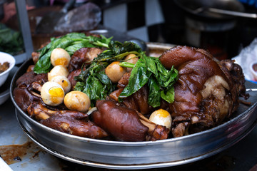 Steamed pork legs with boiled eggs in a big stew pot