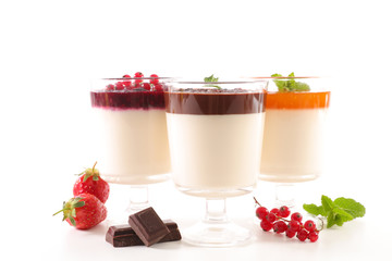 panna cotta with apricot jelly, berry fruit jelly and chocolate sauce isolated on white background