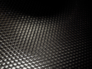 Abstract black background. Honeycombs are hexagons. Selective focus.