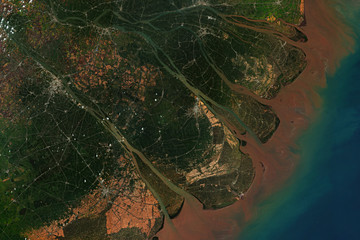 Mekong River Delta in Vietnam, where the Mekong River approaches and empties into the South China...