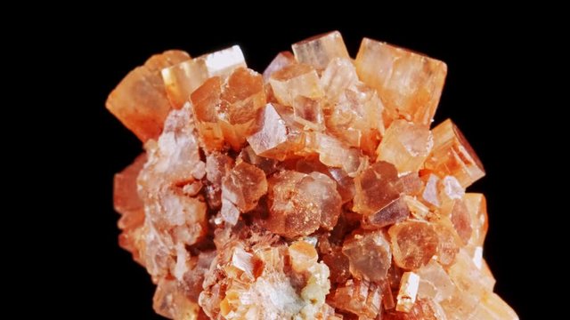 Macro view over brown Aragonite Star Clusters. rotating mineral