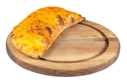 tasty homemade calzone pizza on a white plate. italian food isolated on the white background