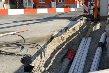 new pipes laid in a civil engineering shaft in the street with vertical and horizontal barrier...