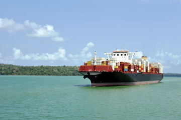 Large container ship transiting through Panama Canal on her international trade route. 