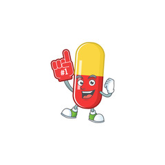 Cartoon character concept of red yellow capsules holding red foam finger
