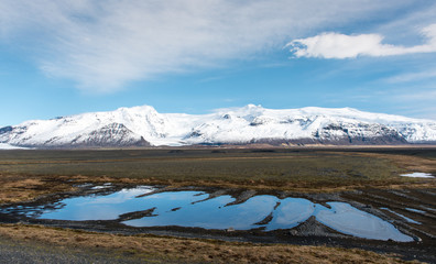 Fototapeta na wymiar Winter Icelandic landscape with lake and mountains. Iceland