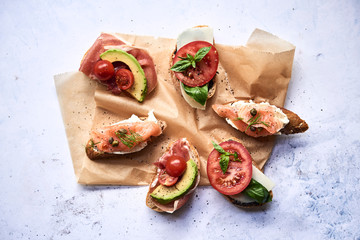 Sandwitches with tamatoes, avocado and salmon