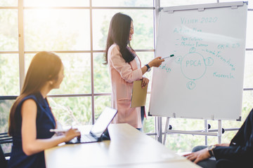 Business woman presenting work planing at office. Teamwork meeting and partnership conference working concept.
