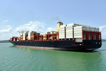 Large container ship transiting through Panama Canal on her international trade route. 
