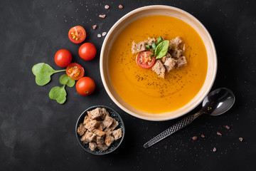 Vegetable soup puree with croutons homemade and tomatoes. greens
