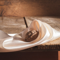 Minimalistic still life with 3 walnuts.