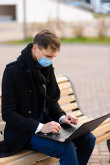 People with face mask. Concept with copy space. Portrait of adult man in quarantine of flu. Photo on the street in the city