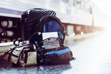 Solo woman backpacker traveler plan safety trip low cost budget summer holiday after coronavirus. Empty tourist on train railway platform. Use bus train sustainable environmental friendly transport