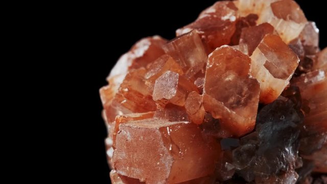 Macro view over brown Aragonite Star Clusters. rotating mineral
