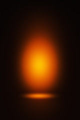 Abstract background with orange spotlight on a dark background, suitable for product photography