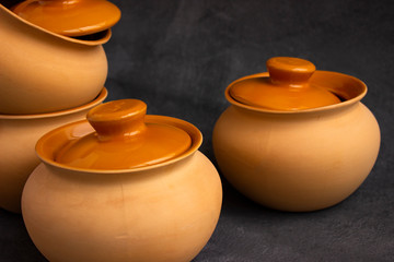 clay pots on a wooden table