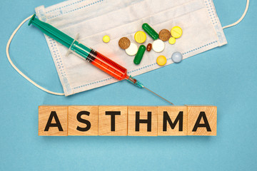 Asthma word made with wood cubes. Asthma word as medical concept