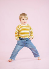 portrait of little model boy in studio