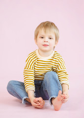 portrait of little model boy in studio