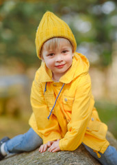 portrait of little model boy in nature