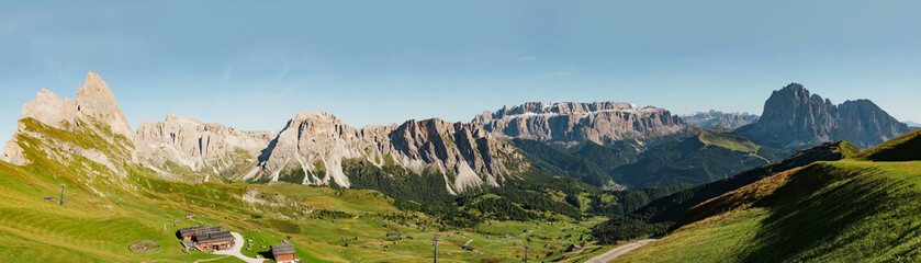 Amazing panoramic view in the Dolomites mountains. Views from Seceda over the Odle rocks are spectacular. Beautiful aerial shot of the valley. Italian nature horizon landscape. Freedom concept.