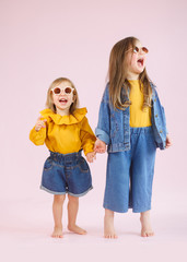 portrait of two girls sisters in the studio