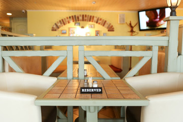 restaurant table with a sign reserved
