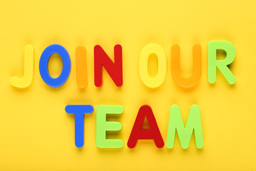 Text Join Our Team by colorful letters on yellow background