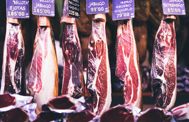 Spanish hamon in barcelona market, jamon iberico in view black leg pork isolated, traditional...