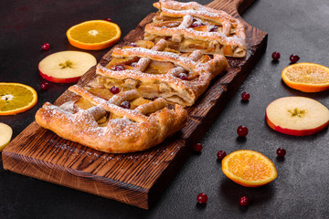 Delicious fresh pie baked with apple, pears and berries