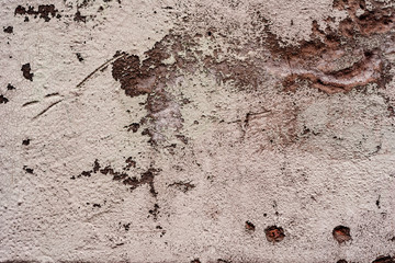 Texture of a concrete wall with cracks and scratches which can be used as a background