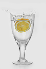 glass of ripe fruit splashing into water