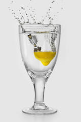 glass of ripe fruit splashing into water