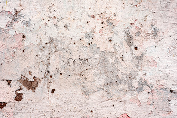 Texture of a concrete wall with cracks and scratches which can be used as a background