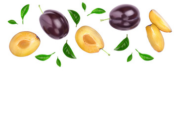 fresh purple plum and half with leaves isolated on white background with clipping path and copy spase for your text. Top view. Flat lay