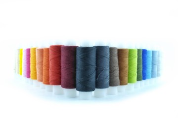 Needle and colored thread for little repairs around the house on clothes etc.