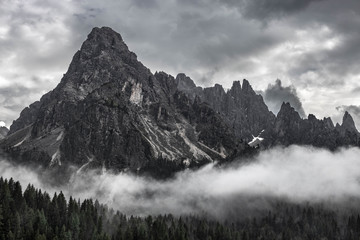 Moody picture of Cadin di Misurina mountains, covered in clouds in bad weather. Cortina d'Ampezzo, Italy