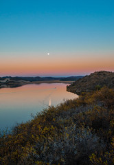 sunset over the lake with a boat