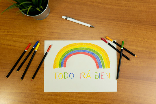 Set with plant pen pencils and Paper with rainbows and a phrase in spanish saying Everything will be alright